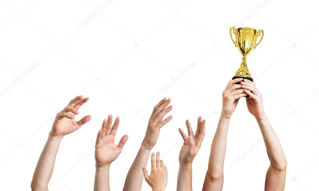 Many hands raised up. Winner is holding trophy in hands. Isolated on white background.