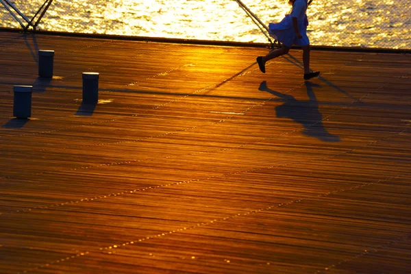 Girl Running Twilight Wood Deck — Stock Photo, Image