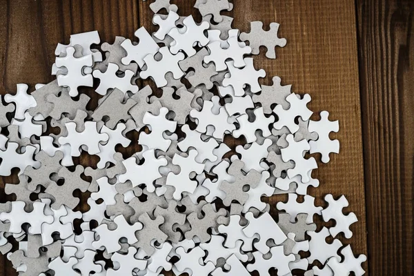 White jigsaw puzzle that has been placed on a desk