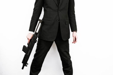 Makineli tüfekle dövüşecek bir iş adamı