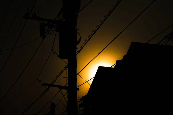 Utility Poles House Silhouette — Stock Photo, Image