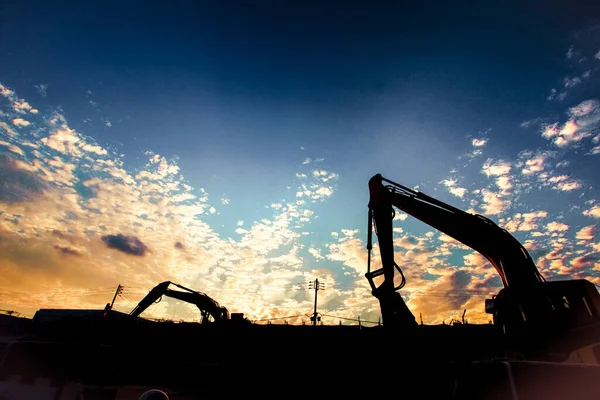 Of the shovel car silhouette and sunset