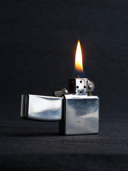 Close Metal Gas Lighter Burning Fire Grey Background Copy Space — Stock Photo, Image
