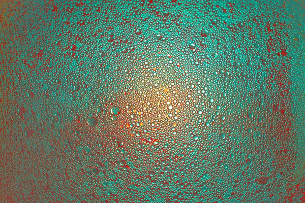 Cyan Orange Teal Oil Droplets Illuminated Colored Bulb Dark Background — Stock Photo, Image