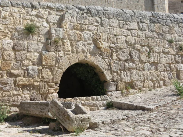 Stone wall with old well