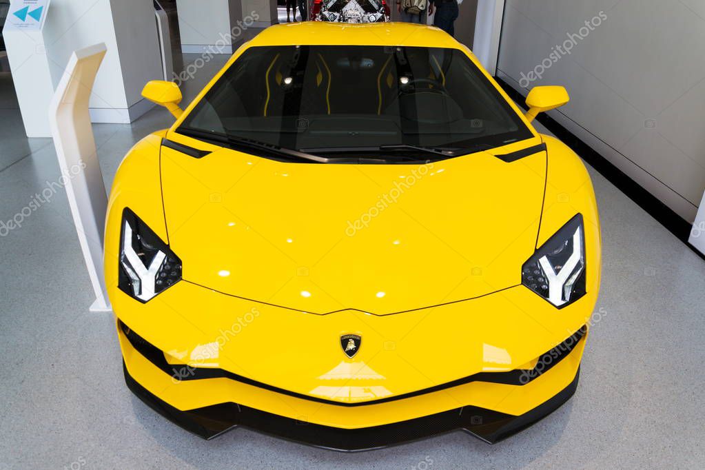 BERLIN, GERMANY - APRIL 15 2018: Lamborghini company logo on Lamborghini Aventador S coupe standing at Volkswagen Group forum Drive on April 15, 2018 in Berlin, Germany.