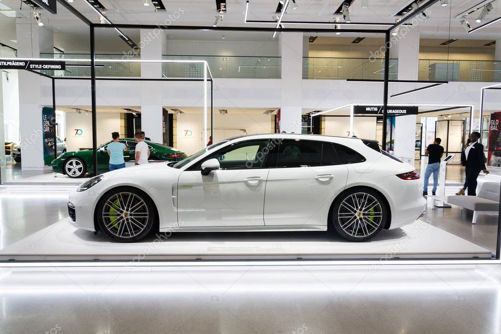 BERLIN, GERMANY - APRIL 15 2018: Porsche Panamera Turbo S E-Hybrid Sport Turismo car standing at Volkswagen Group forum Drive on April 15, 2018 in Berlin, Germany.