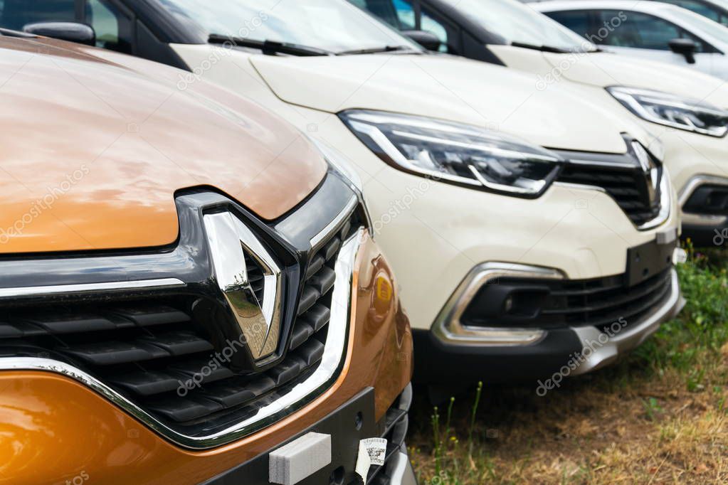 PRAGUE, CZECH REPUBLIC - AUGUST 15 2018: Renault company logo on car in front of dealership building on August 15, 2018 in Prague.