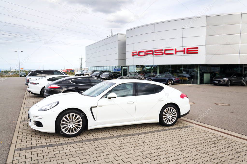 PRAGUE, CZECH REPUBLIC - SEPTEMBER 22 2018: Cars in front of Porsche automotive company dealership buildin on September 22, 2018 in Prague, Czech Republic.