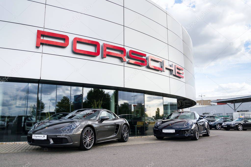 PRAGUE, CZECH REPUBLIC - SEPTEMBER 22 2018: Cars in front of Porsche automotive company dealership buildin on September 22, 2018 in Prague, Czech Republic.