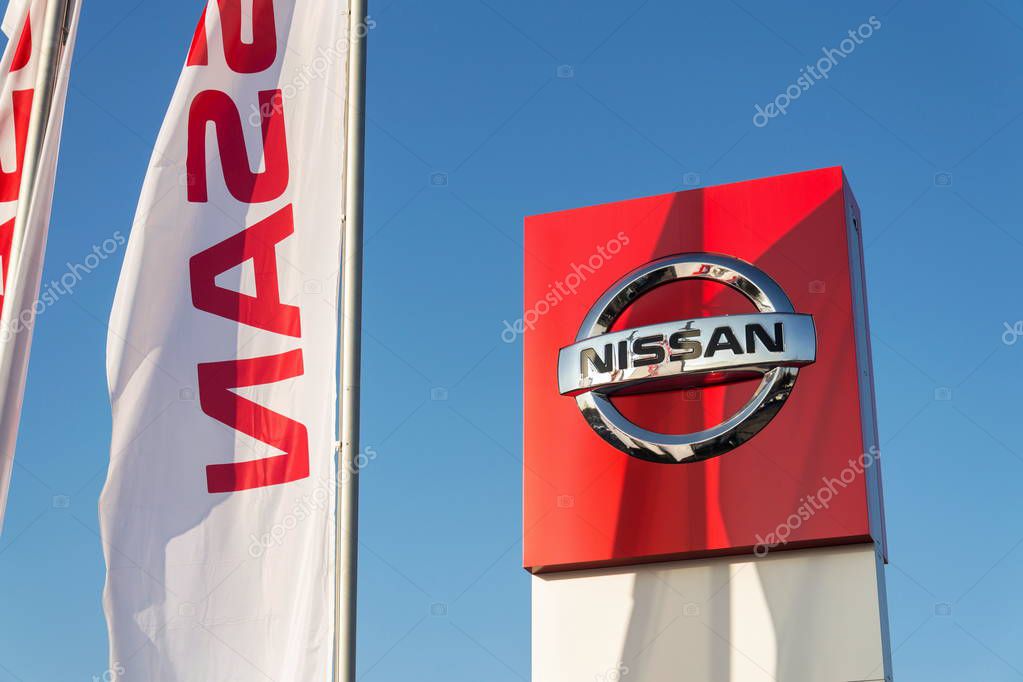 PRAGUE, CZECH REPUBLIC - DECEMBER 13 2018: Nissan motor company logo in front of dealership building on December 13, 2018 in Prague, Czech Republic.