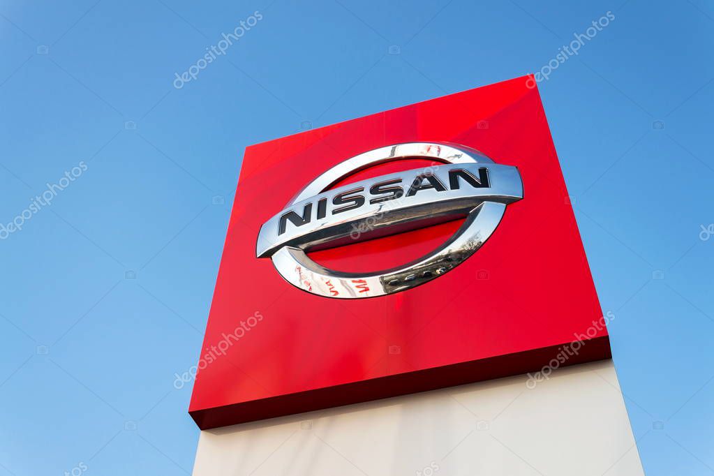 PRAGUE, CZECH REPUBLIC - DECEMBER 13 2018: Nissan motor company logo in front of dealership building on December 13, 2018 in Prague, Czech Republic.