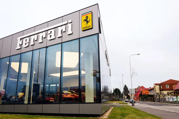 PRAGUE, CZECH REPUBLIC - DECEMBER 23 2018: Ferrari N. V. italian luxury sports car manufacturer company logo in front of dealership building on December 23, 2018 in Prague, Czech Republic.