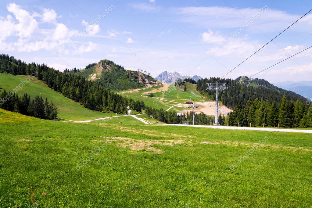 Path to the beautiful Sonntagskogel Mountain in Alps, Sankt Johann im Pongau district, Salzburg federal state, Austria, sunny summer day, clear blue sky, exploration wanderlust concept