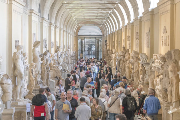 Vatican City, Rome, Italy, October 21, 2017: People look at the sculptures in the museum