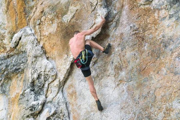 Young Man Climbing Cliff Insurance — 스톡 사진