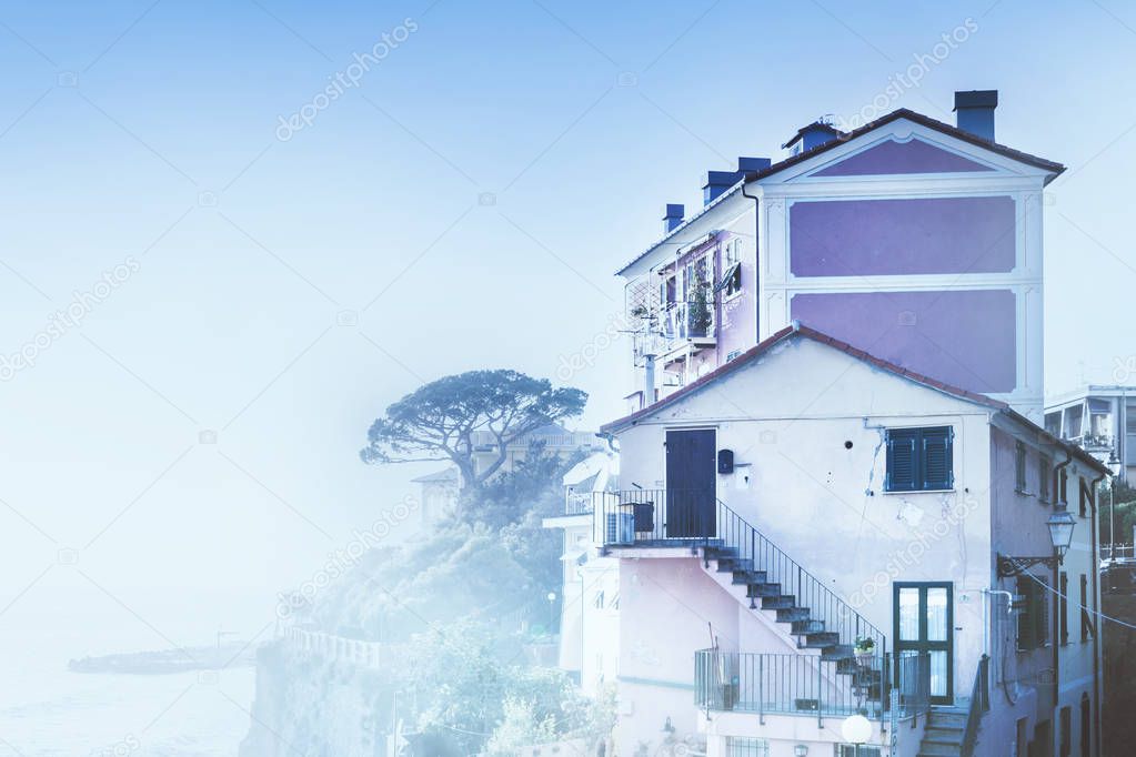 House by the sea in the fog, Italy