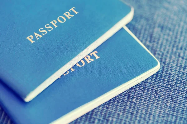 Dois Passaportes Azuis Sobre Fundo Têxtil Azul — Fotografia de Stock