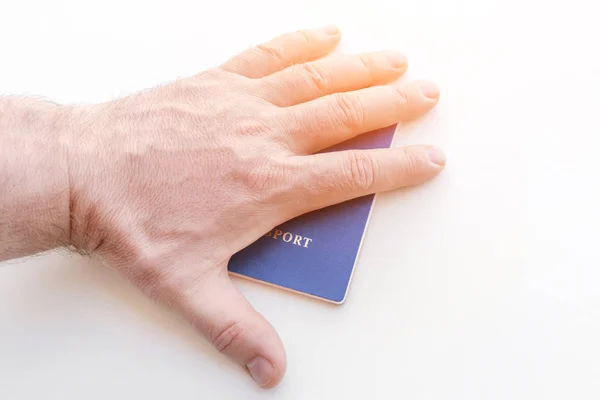 Mannenhand Bovenop Blauwe Paspoort Een Witte Achtergrond — Stockfoto