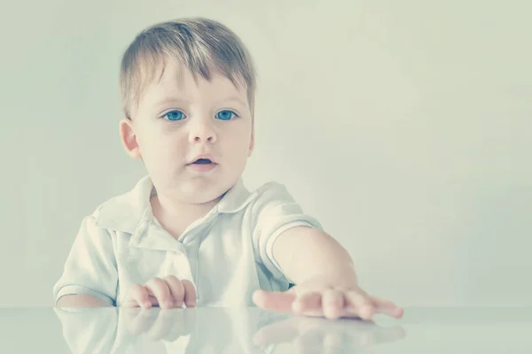 Portrait Blonde Baby Boy Blue Eyes Sitting Table Toned — Stock Photo, Image