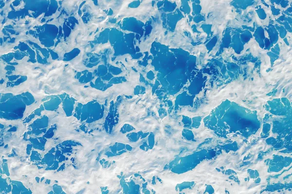 Texture of sea water with foam, background