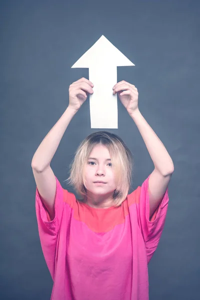 Blonde Girl Teenager Red Blouse Holding White Arrow Pointing Upwards — Stock Photo, Image