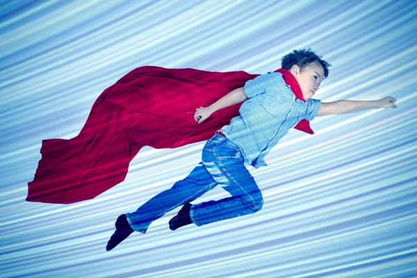 Boy Flying Red Cloak Superhero Blue Background — Stock Photo, Image