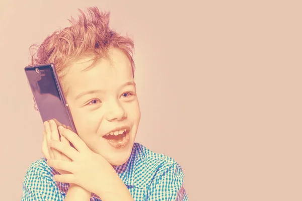 Söt Liten Pojke Blå Skjorta Som Talar Telefon Beige Bakgrund — Stockfoto