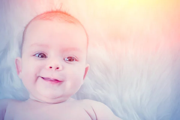 Smiling Cute Baby Lying White Fur Sunlight — Stock Photo, Image