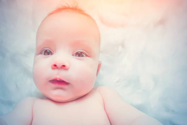 Cute Baby Lying White Fur Sunlight — Stock Photo, Image