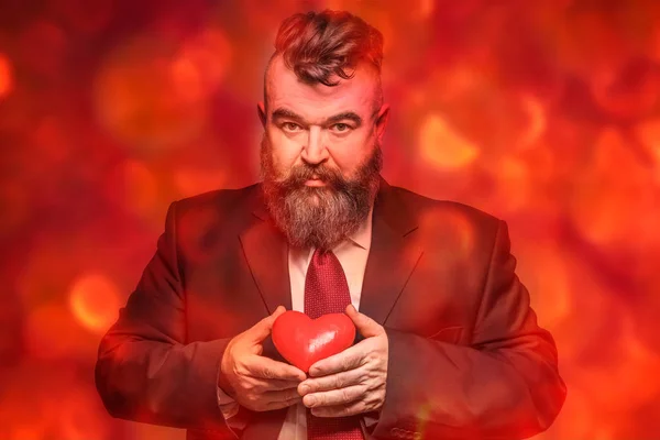 Adult Bearded Man Black Suit Holding Red Heart Red Background — Stock Photo, Image