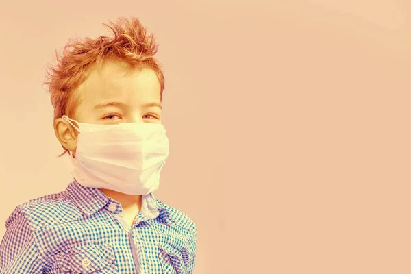 Boy Medical Mask Her Face Beige Background Toned — Stock Photo, Image