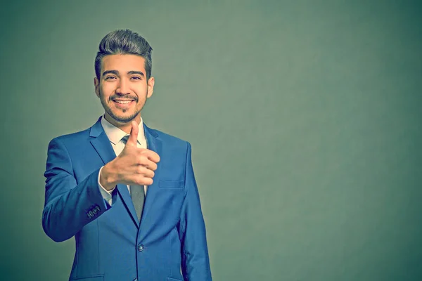 Young Attractive Man Blue Suit Showing Thumb Green Background — Stock Photo, Image