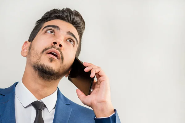 Young Attractive Man Blue Suit Talking Phone Gray Background Isolated — Stock Photo, Image