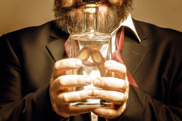 Bearded Man Suit Holding Bottle Alcohol Front Him Toned — Stock Photo, Image