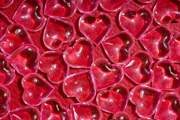 Transparent Glass Hearts Red Leather Background — Stock Photo, Image