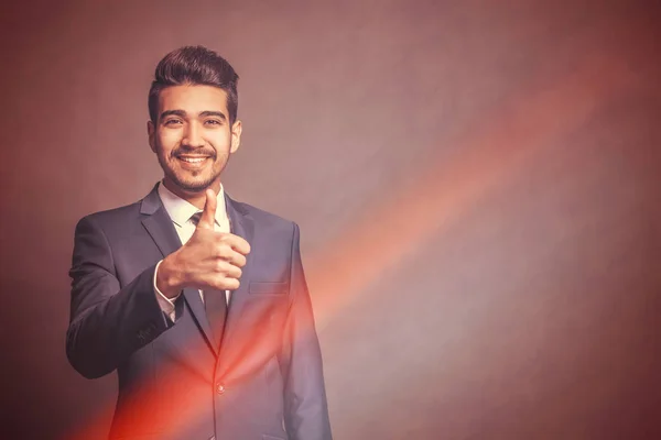 Young Attractive Man Blue Suit Showing Thumb Brown Background Light — Stock Photo, Image