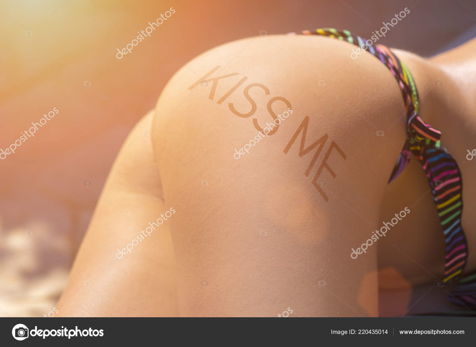 Beautiful Female Ass Bikini Inscription Kiss Sunlight Stock Photo by ©watman 220435014