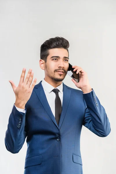 Young Attractive Man Blue Suit Talking Phone Gray Background Isolated — Stock Photo, Image