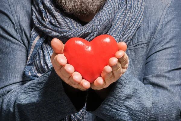 Adult Bearded Man Blue Jacket Scarf Holding Red Heart — Stock Photo, Image