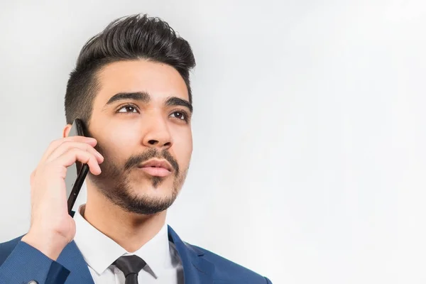 Young Attractive Man Blue Suit Talking Phone Gray Background Isolated — Stock Photo, Image