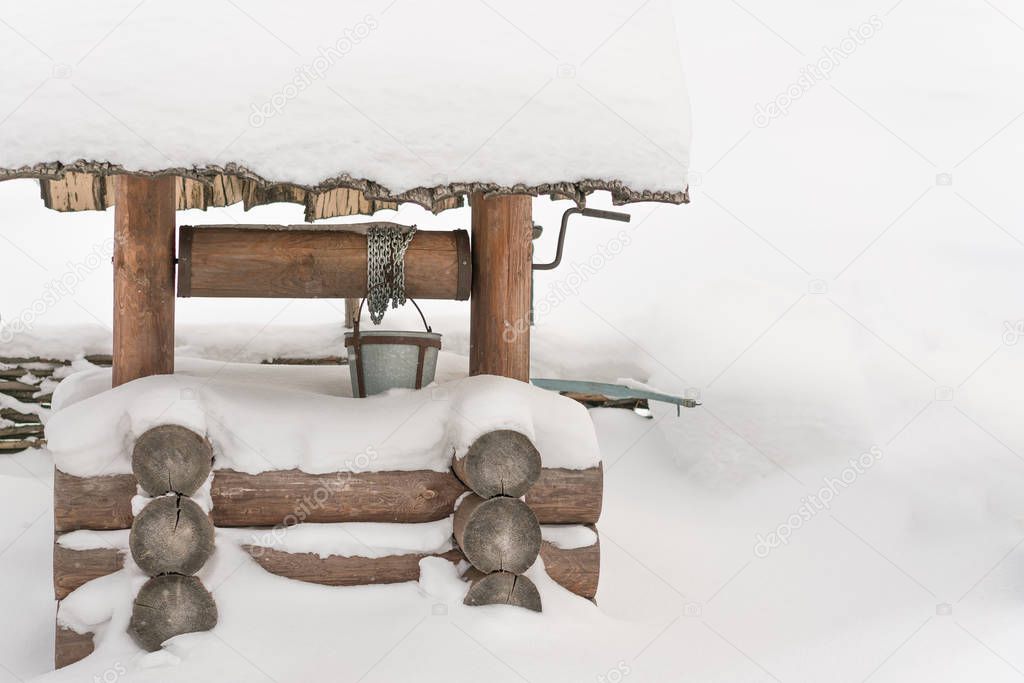 Wooden well in the snow