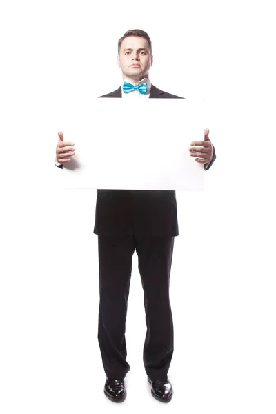 A man in suit holds white sheet. — Stock Photo, Image