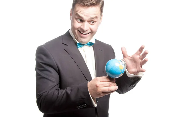 Funny man in blue bow tie holding little glode with crazy, weird — Stock Photo, Image