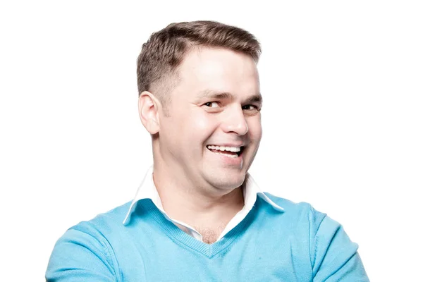 Laughing young man on a white background in the studio. — Stock Photo, Image