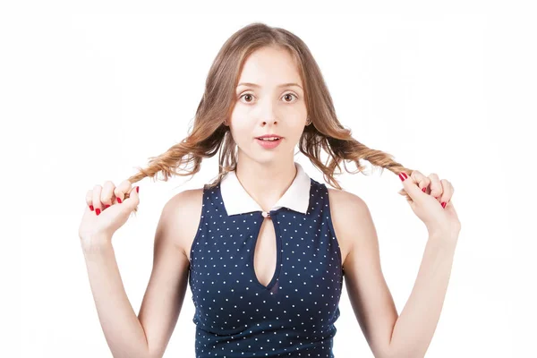 Girl holds in hands the twisted hair on a white background in th — Stock Photo, Image