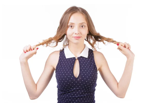 The girl holds in her hands strands of hair on a white backgroun — Stock Photo, Image