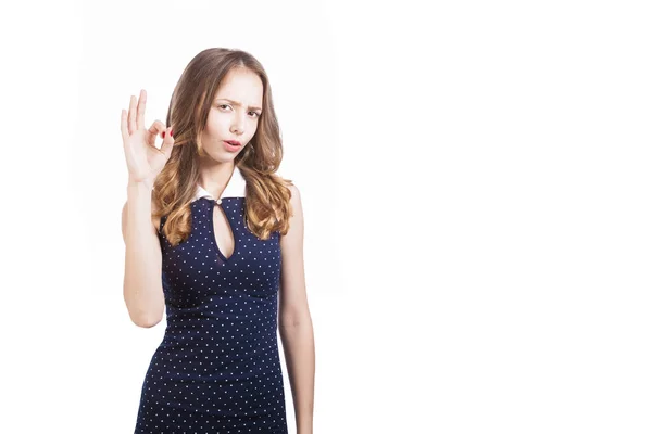 Girl shows ok sign on a white background in the studio. — Stock Photo, Image