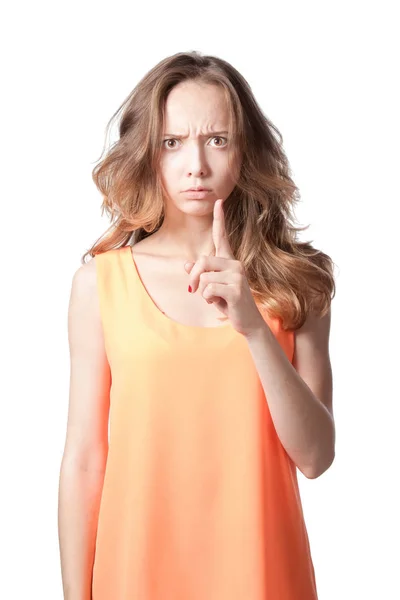 Gloomy girl threatens with a finger on a white background. — Stock Photo, Image