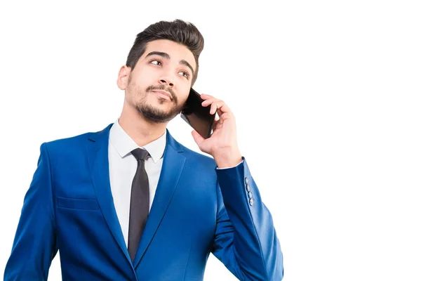 Cute man in a blue suit talking on the phone on a white backgrou — Stock Photo, Image